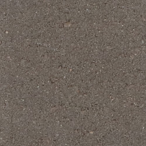 Detailopname van het oppervlak van een bruine betonstraatsteen met een fijne, licht ruwe textuur. De kleur is egaal met subtiele kleurnuances en kleine korrels zichtbaar.