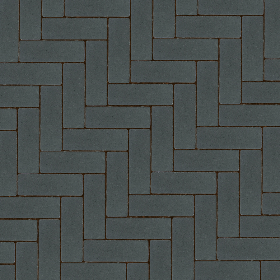 Straatbeeld met rode betonstenen gelegd in een elleboogverband. De stenen hebben een egale kleur en een fijne textuur, geschikt voor een strakke en moderne bestrating.